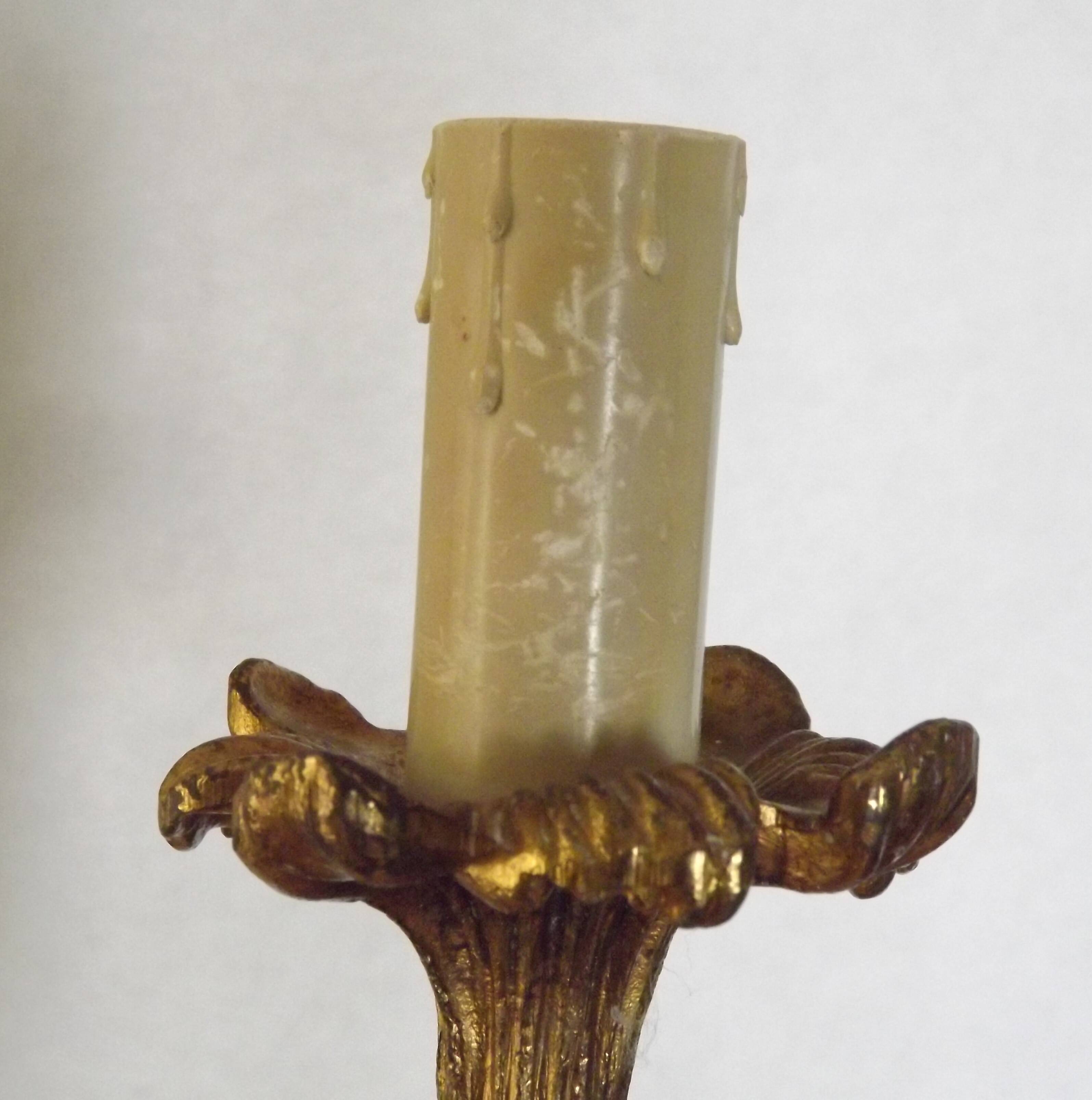 Pair of simple vintage French wall sconces in Art Nouveau bronze with leaf-shaped details.