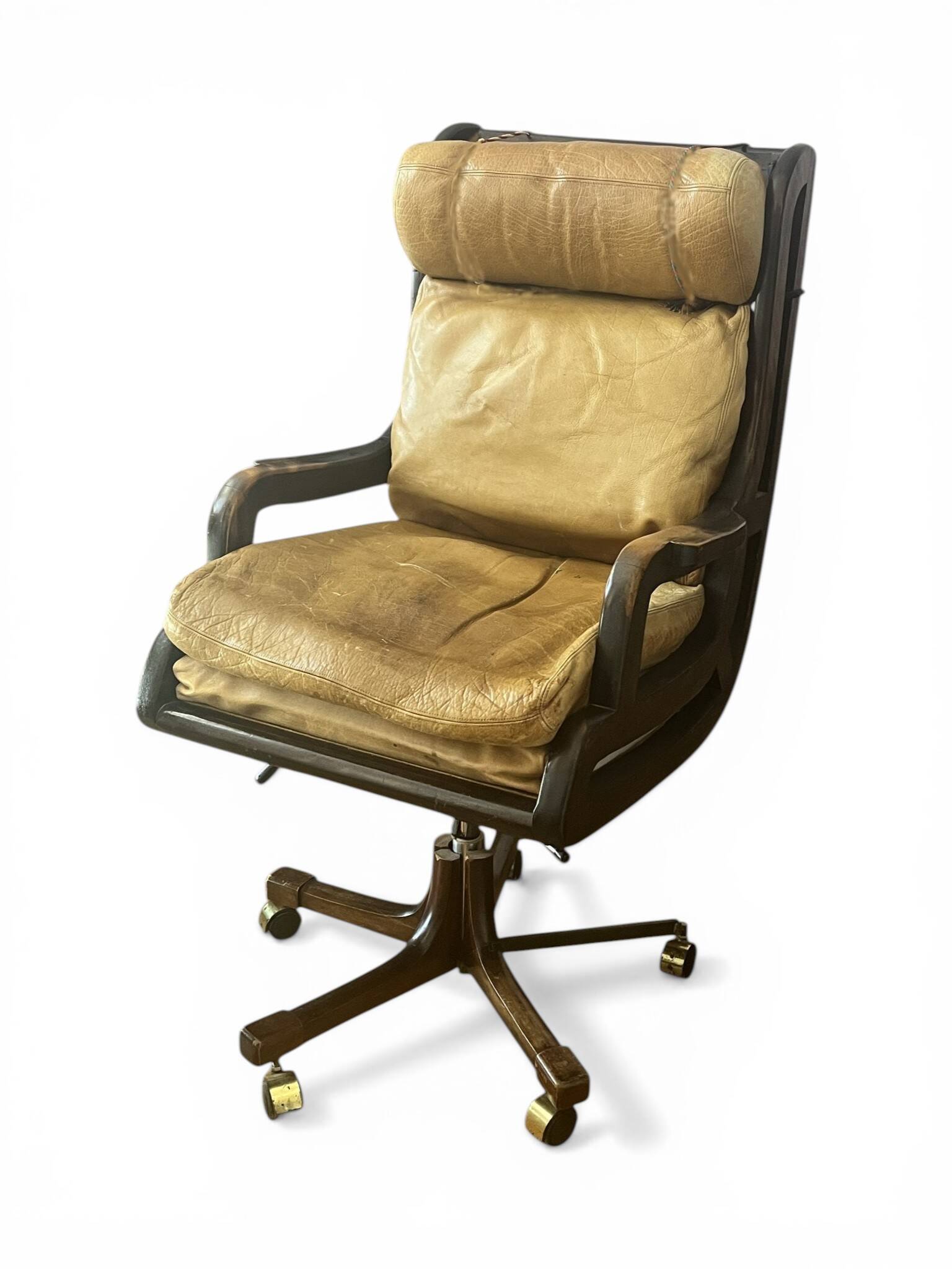 Vintage mahogany and havana leather office chair with wheels from around 1970.