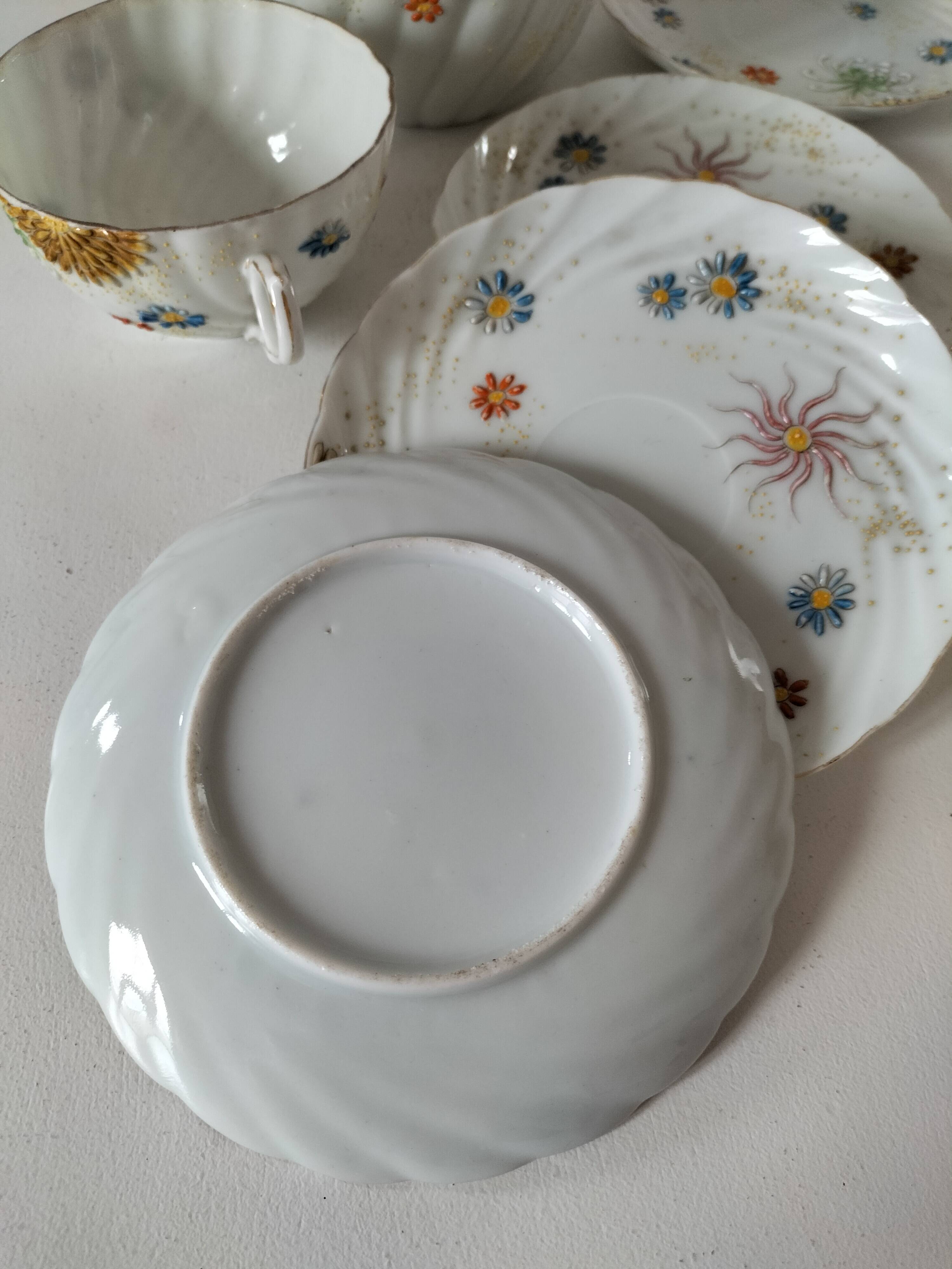 coffee pot, cup and saucers