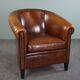 Club armchair in sheepskin with black piping
