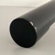 Minimalist black metal wall light with a cylindrical design, 1960s, Germany.