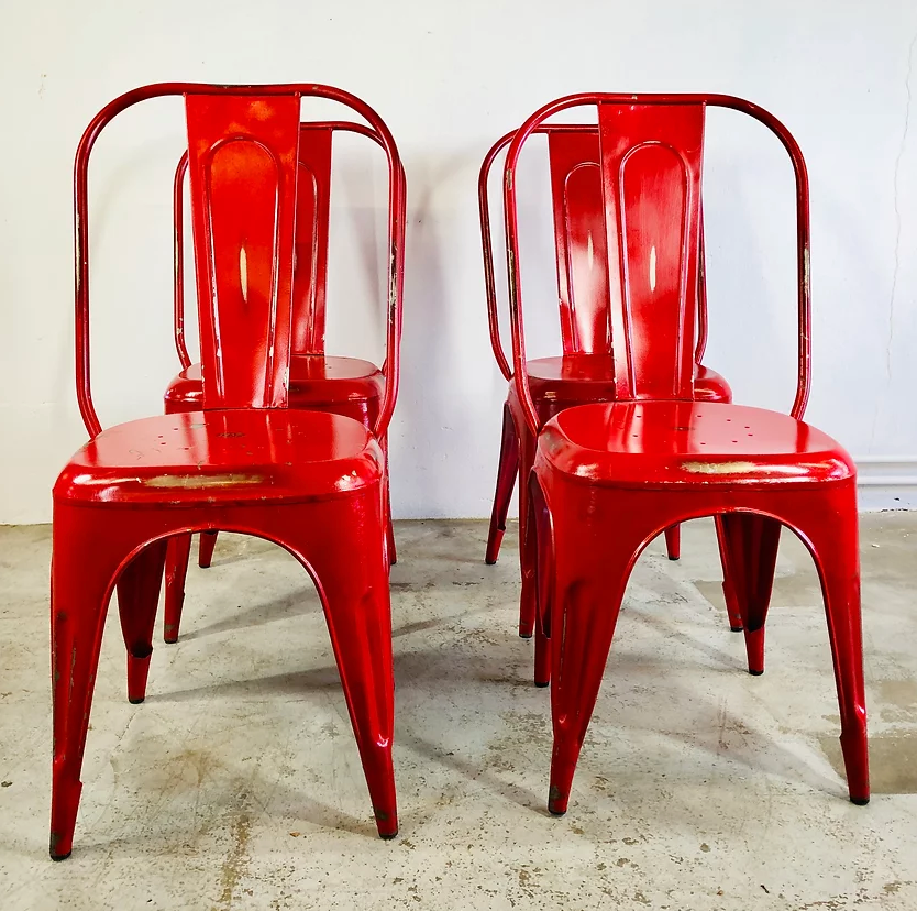Set of four low chairs in red steel
