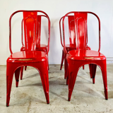 Set of four low chairs in red steel