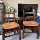 Pair of vintage armchairs with turned wood and woven rope seat.
