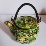Set of old teapots and honey pot