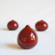 Trio of red miniature ceramics by Antonio Lampecco