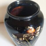Old enameled earthenware vase with daffodils early 20th century