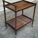Vintage rolling bar side table in chic rustic style from the 1950s.
