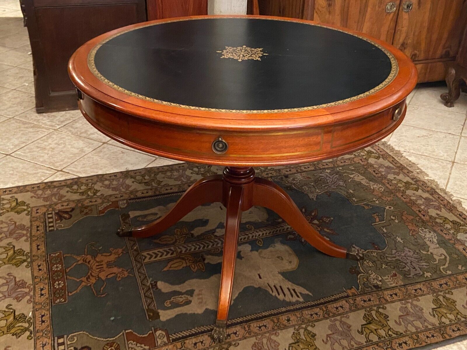 Circular table in solid mahogany and black leather claw base Restoration