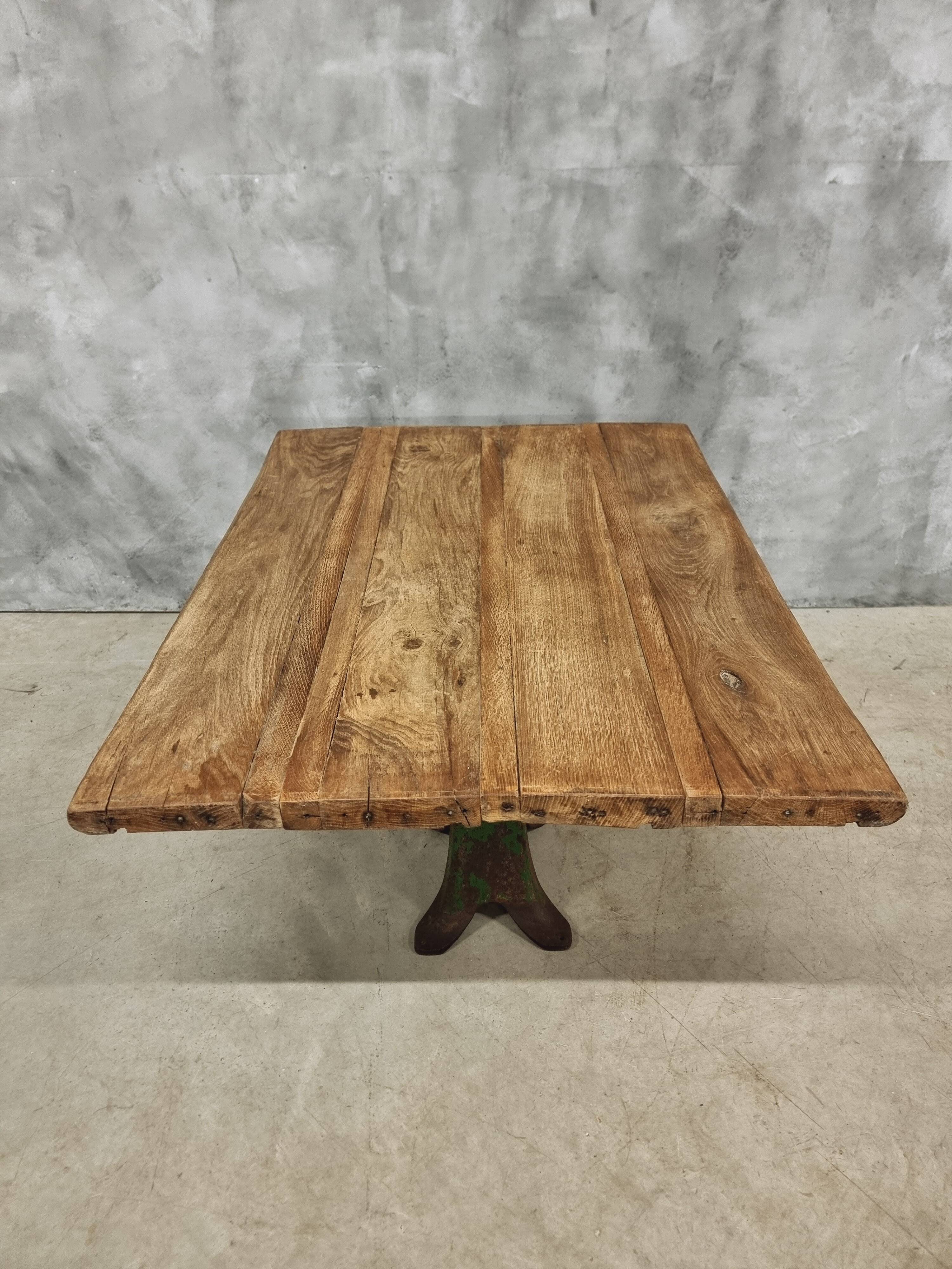 Antique oak dining table on cast iron base 93 x 123 cm