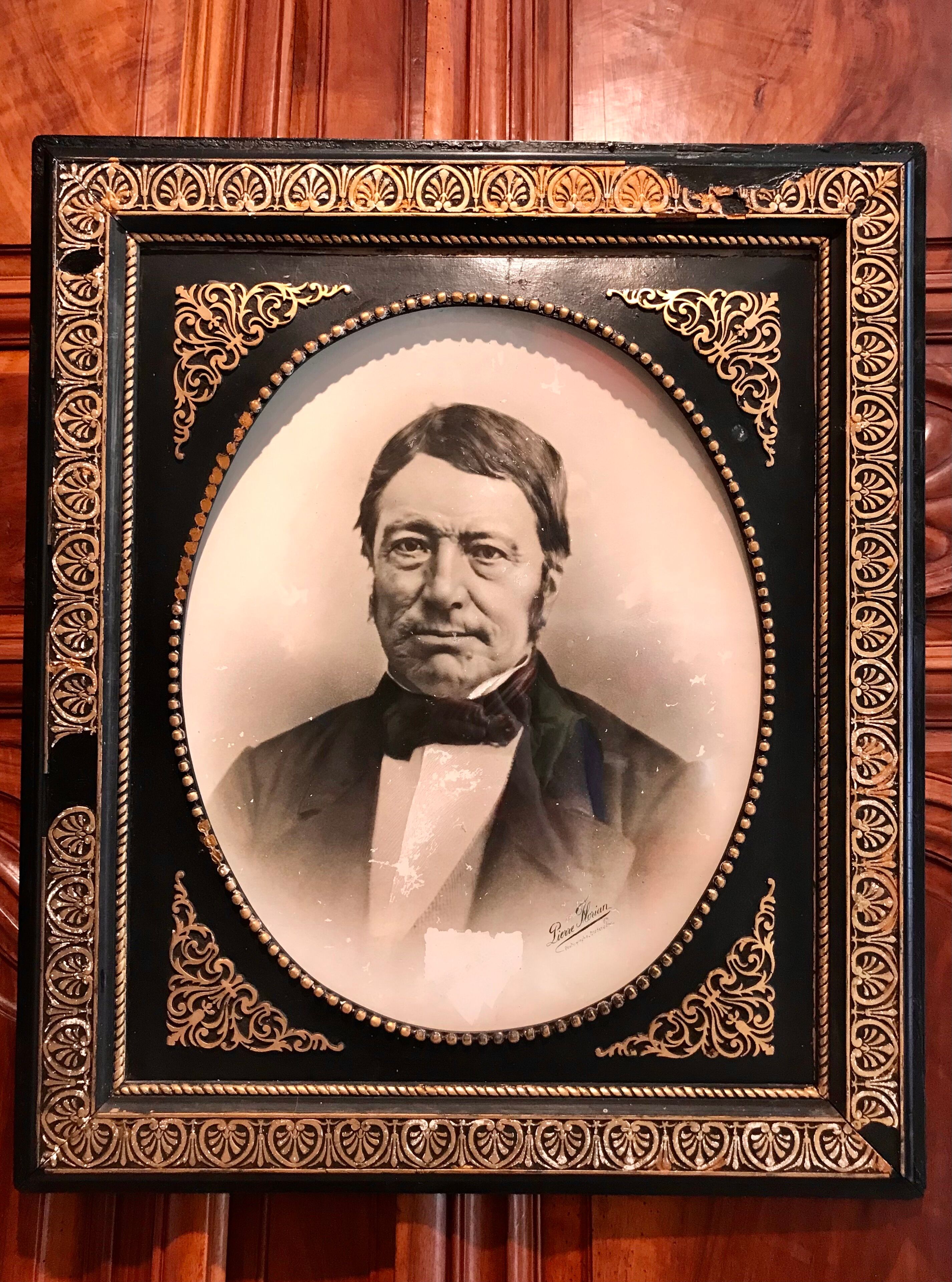 Black and gilded ebonite frame, wood and plaster 19th century