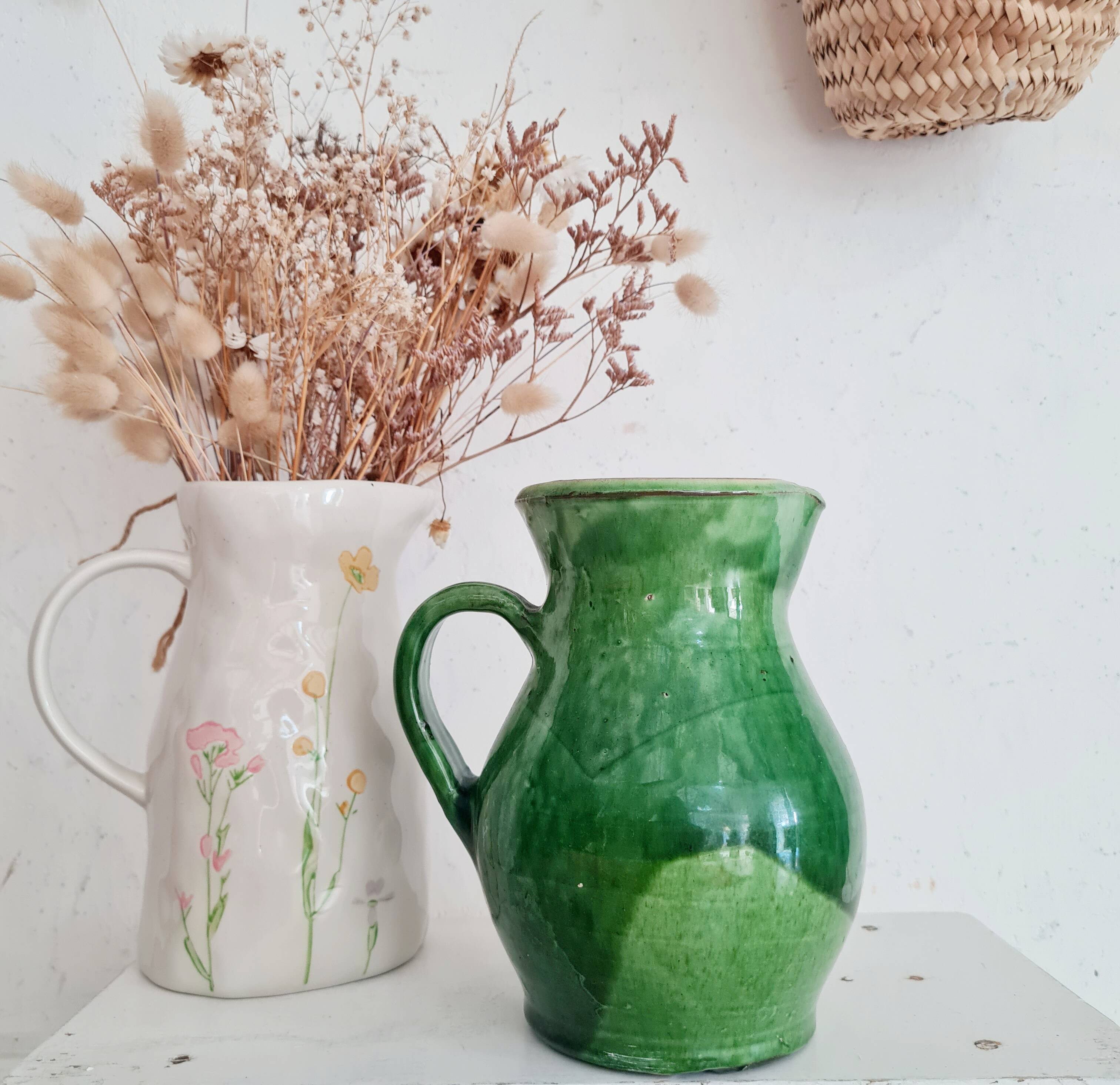 Antique green pitcher in painted terracotta