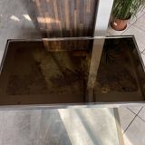 Coffee table with chrome base and mirrored glass top, vintage solar flare decor