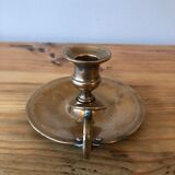 Old copper hand-held candlestick
