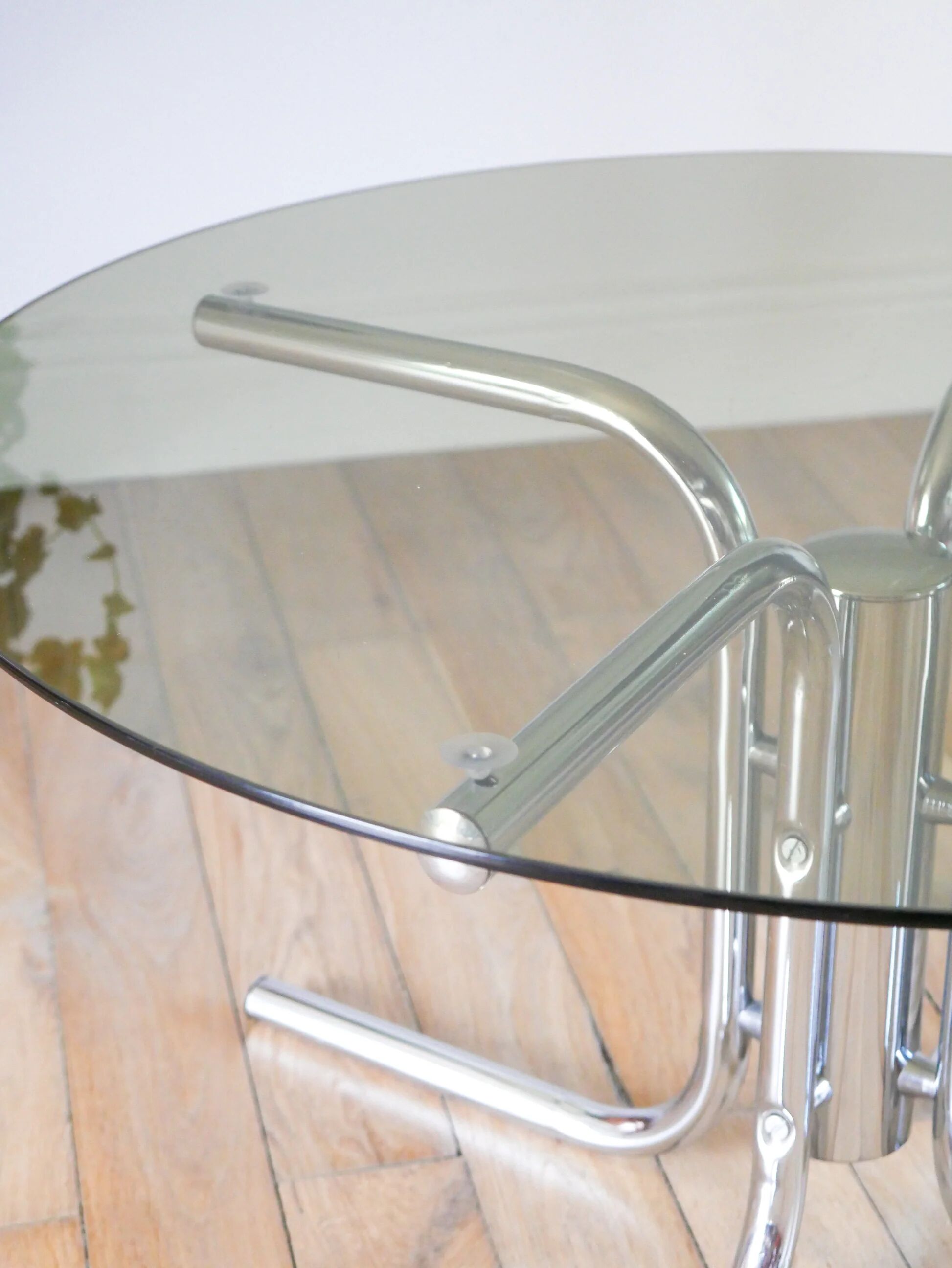Round coffee table in smoked glass and chrome, star base, design, 1970.