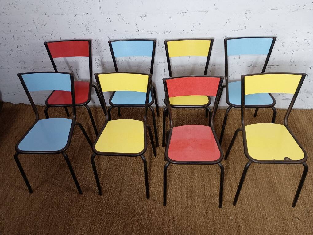 8 canteen chairs, yellow, blue, and red Formica with metal tubing from the 1950s-60s.