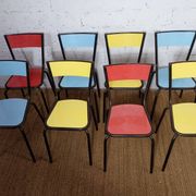 8 canteen chairs, yellow, blue, and red Formica with metal tubing from the 1950s-60s.