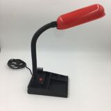 Duo of red and black flexible desk lamps with pencil holder