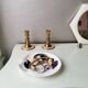White ceramic dish shaped like 80s shells