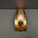 Older wall lamp in brass with hard pressed glass shade.