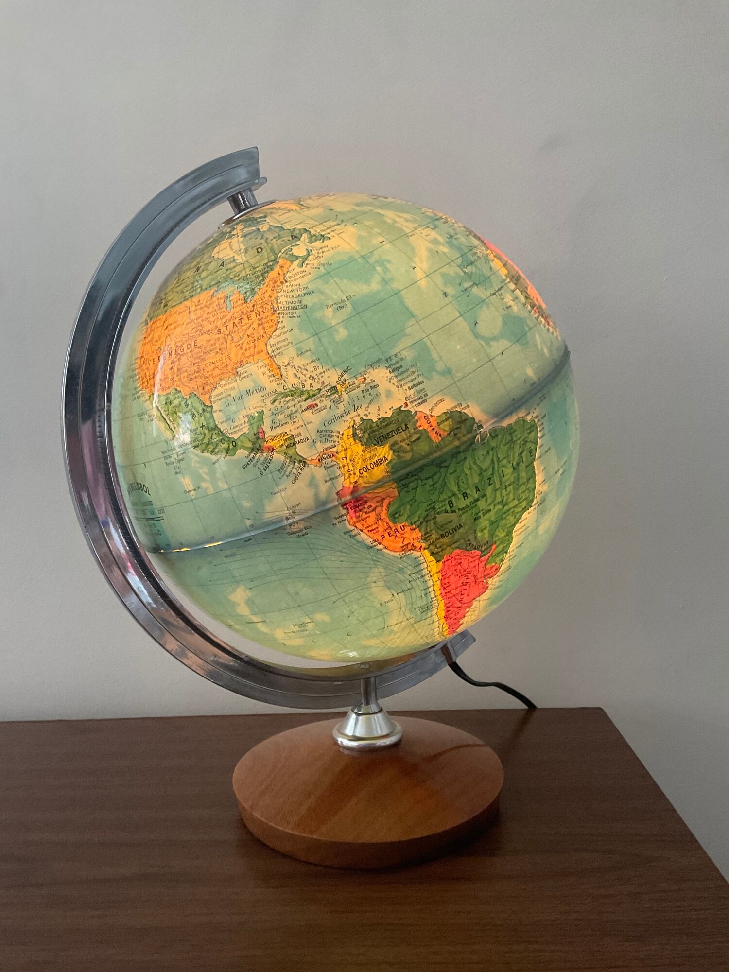Bright vintage world map with wooden foot