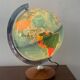 Bright vintage world map with wooden foot