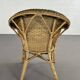 Cabriolet style armchair in rattan, wicker and green and red edging