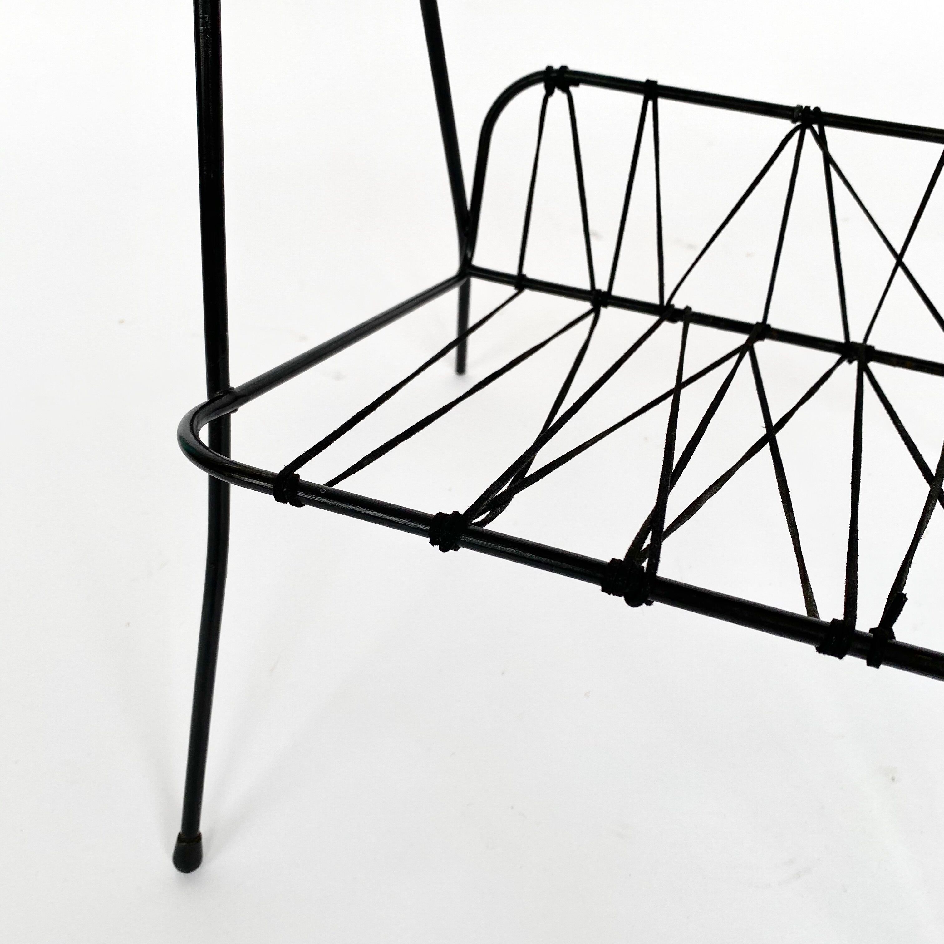 Side table with vintage metal and wood magazine holder