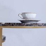Trundle tables in imperial brown marble.