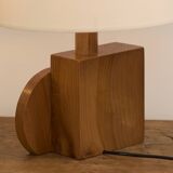 Pair of geometric handcrafted lamps in solid oak circa 1970.