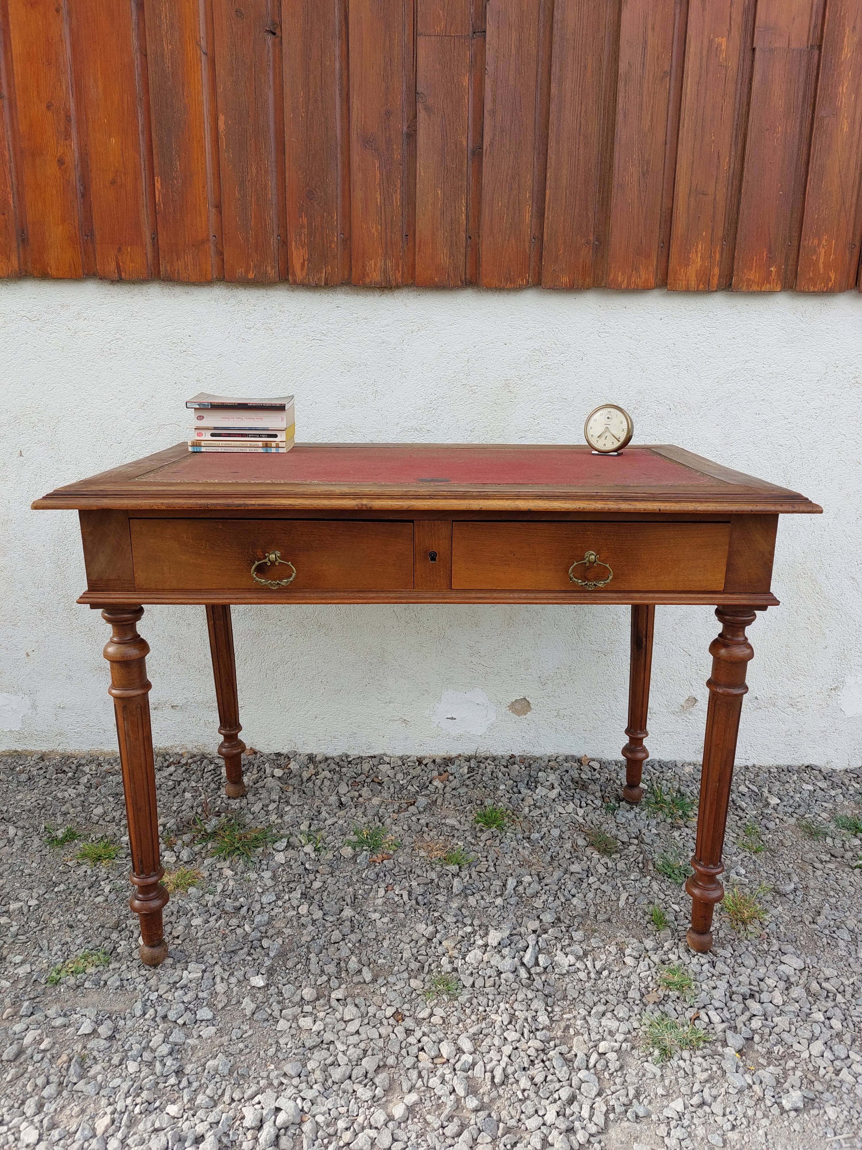 Old wooden desk, red felt top