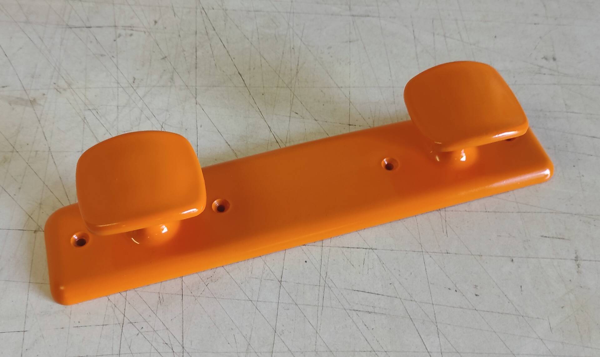 Orange plastic coat rack by Syla - 70's