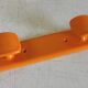 Orange plastic coat rack by Syla - 70's