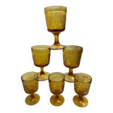Six stemmed glasses in amber-colored molded glass