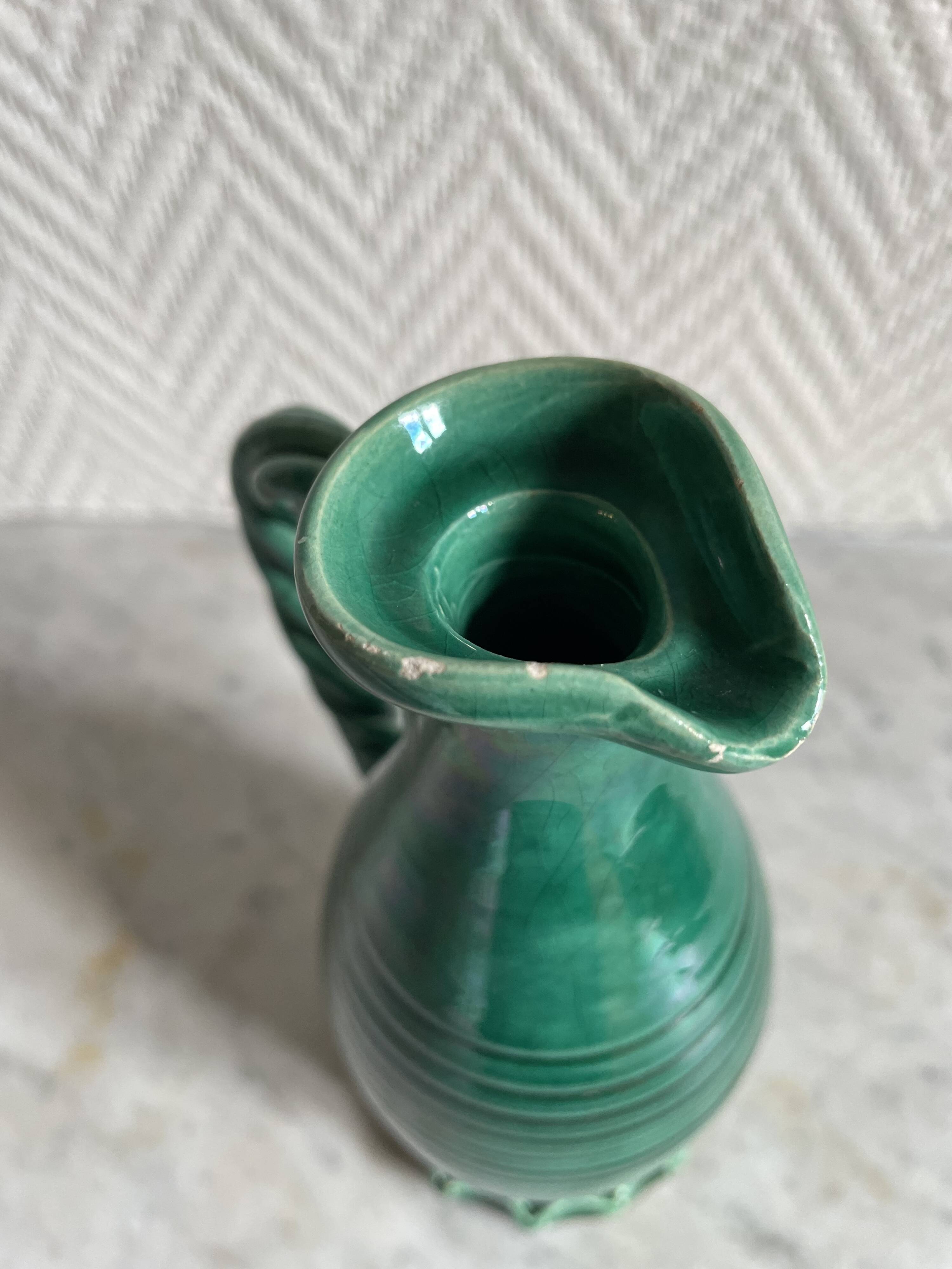 Small green ceramic pitcher
