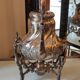 Ancient samovar tea fountain in silver metal