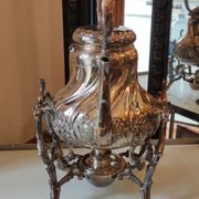 Ancient samovar tea fountain in silver metal