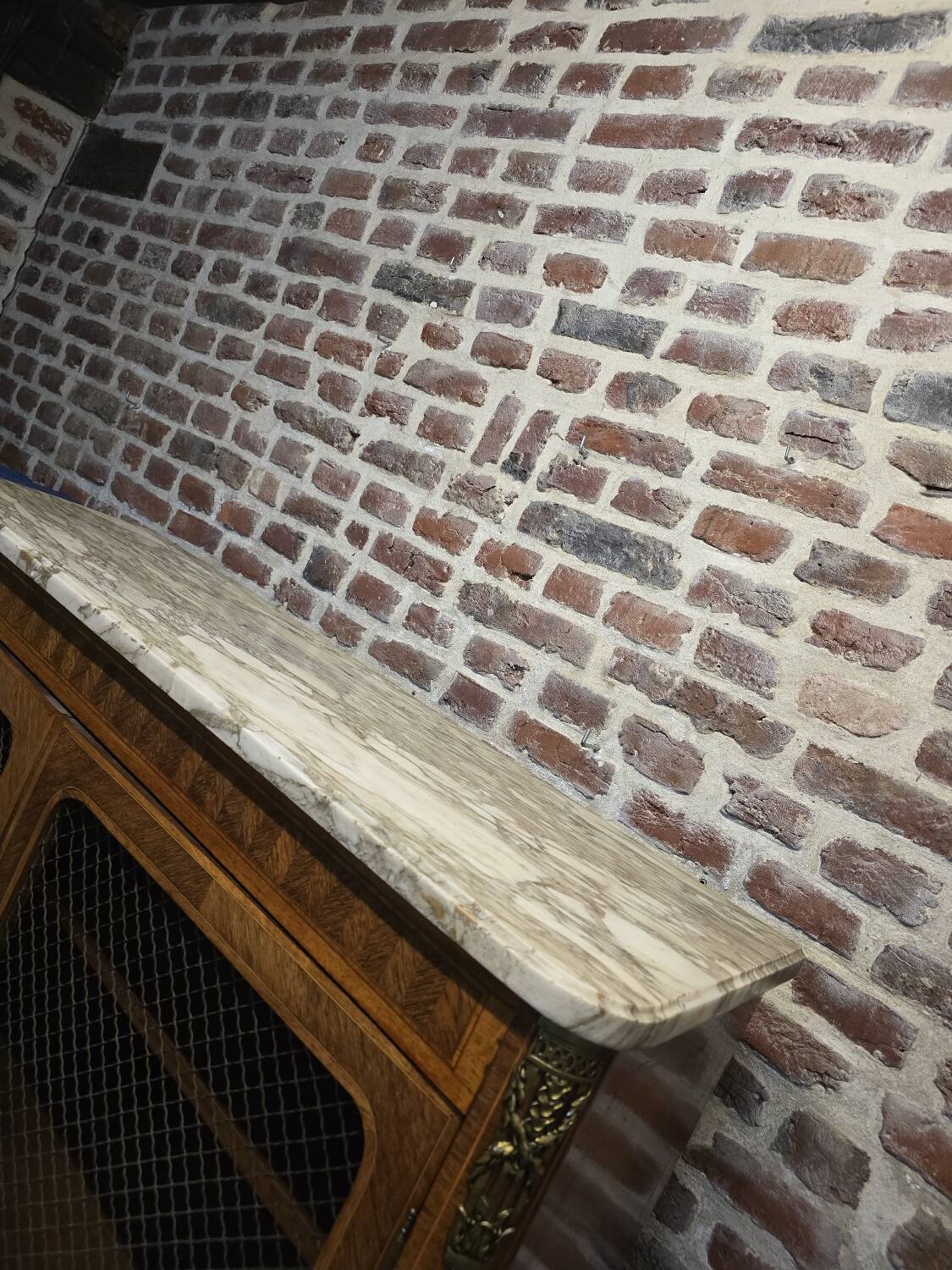 Marquetry bookcase with marble top