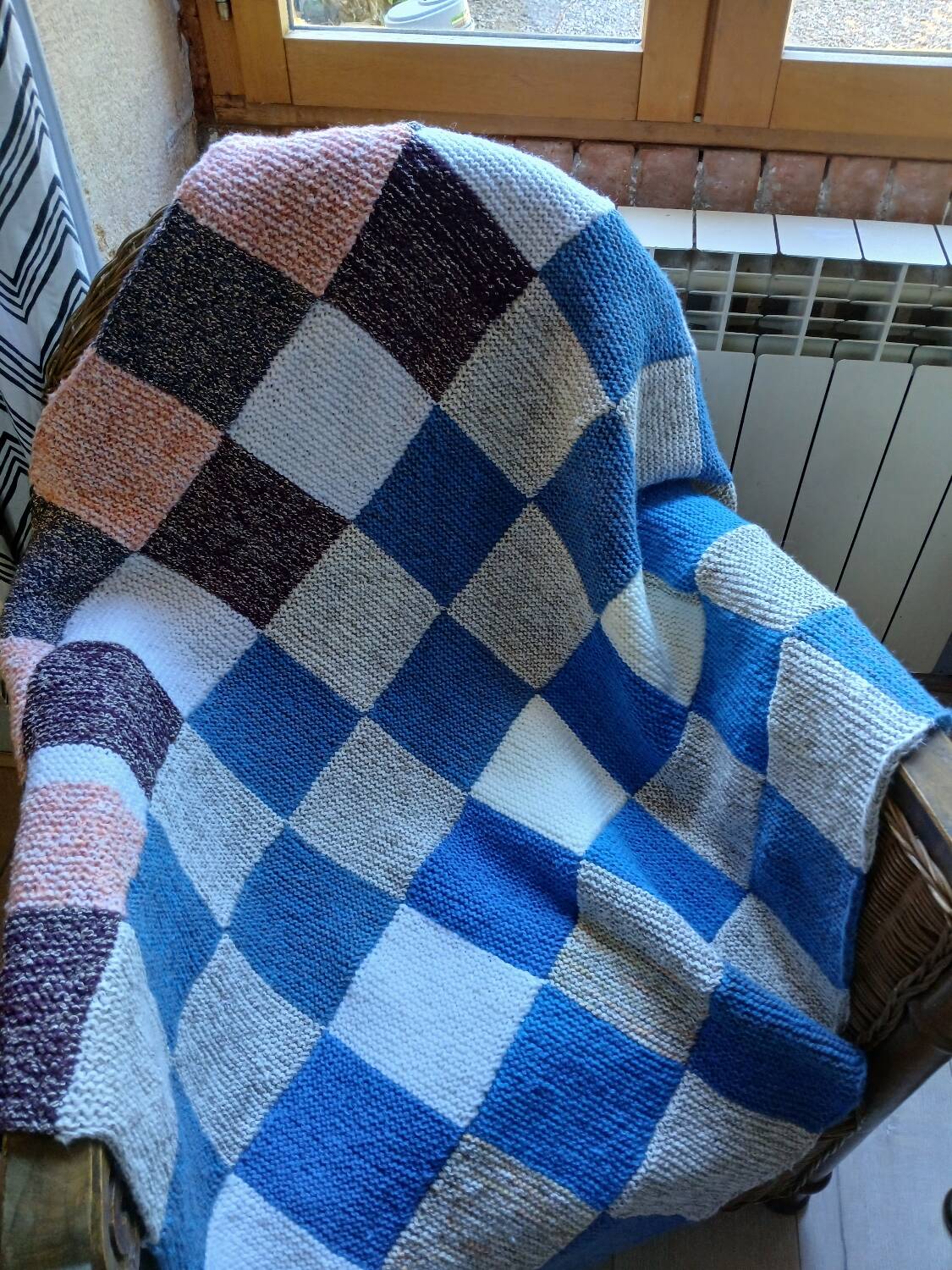 Hand knitted patchwork plaid