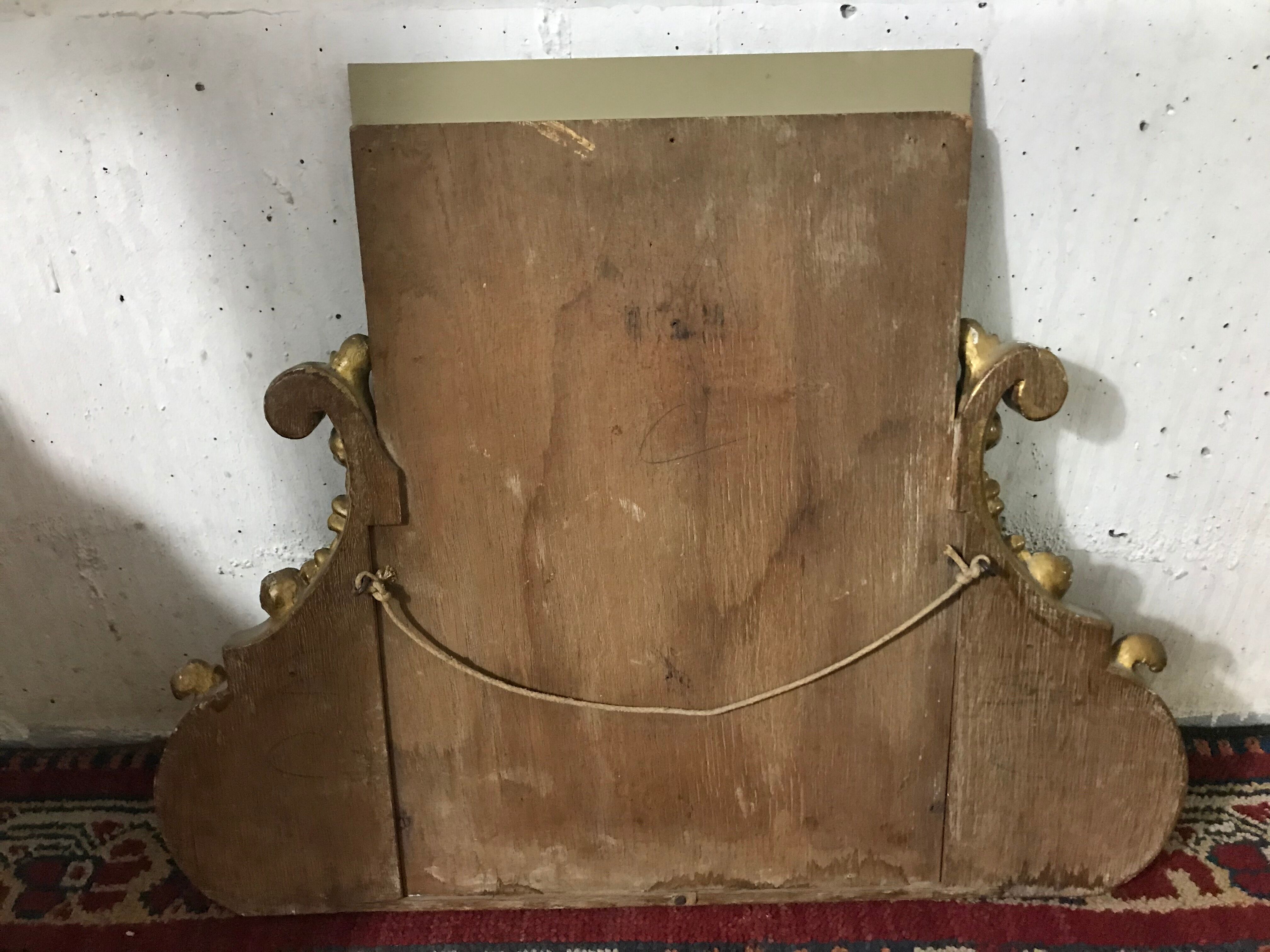 Old golden stucco mirror