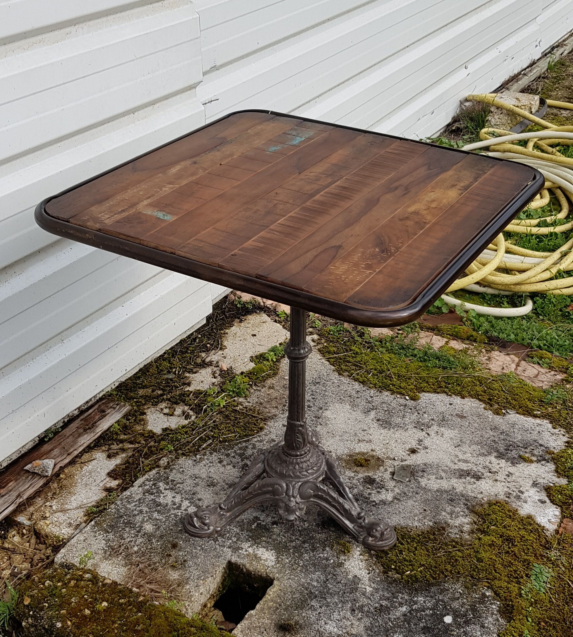 Wooden tray bistro table with old cast iron base