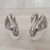 Two frosted glass swan salt cellars with silver plating.