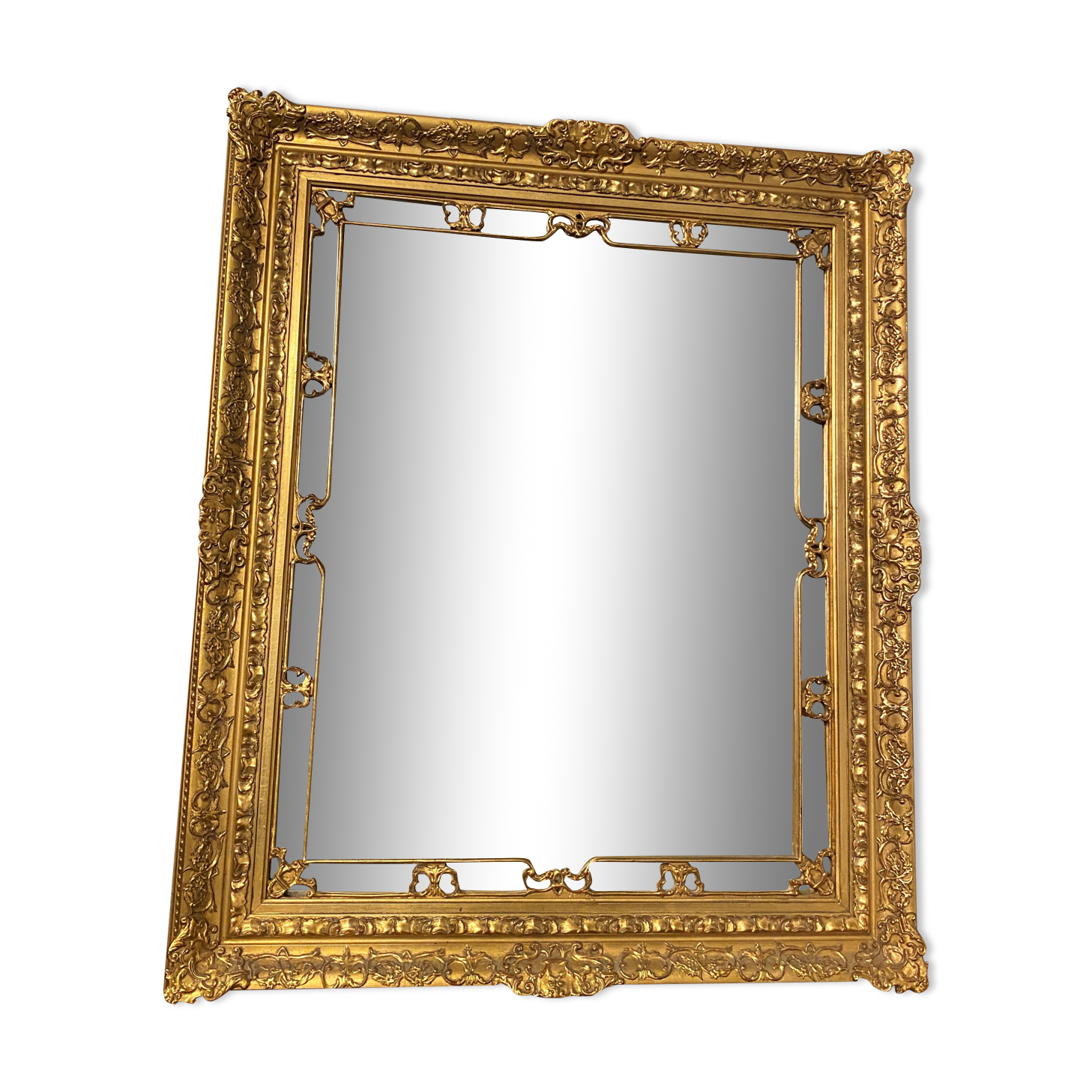 Wooden mirror with gilded stucco