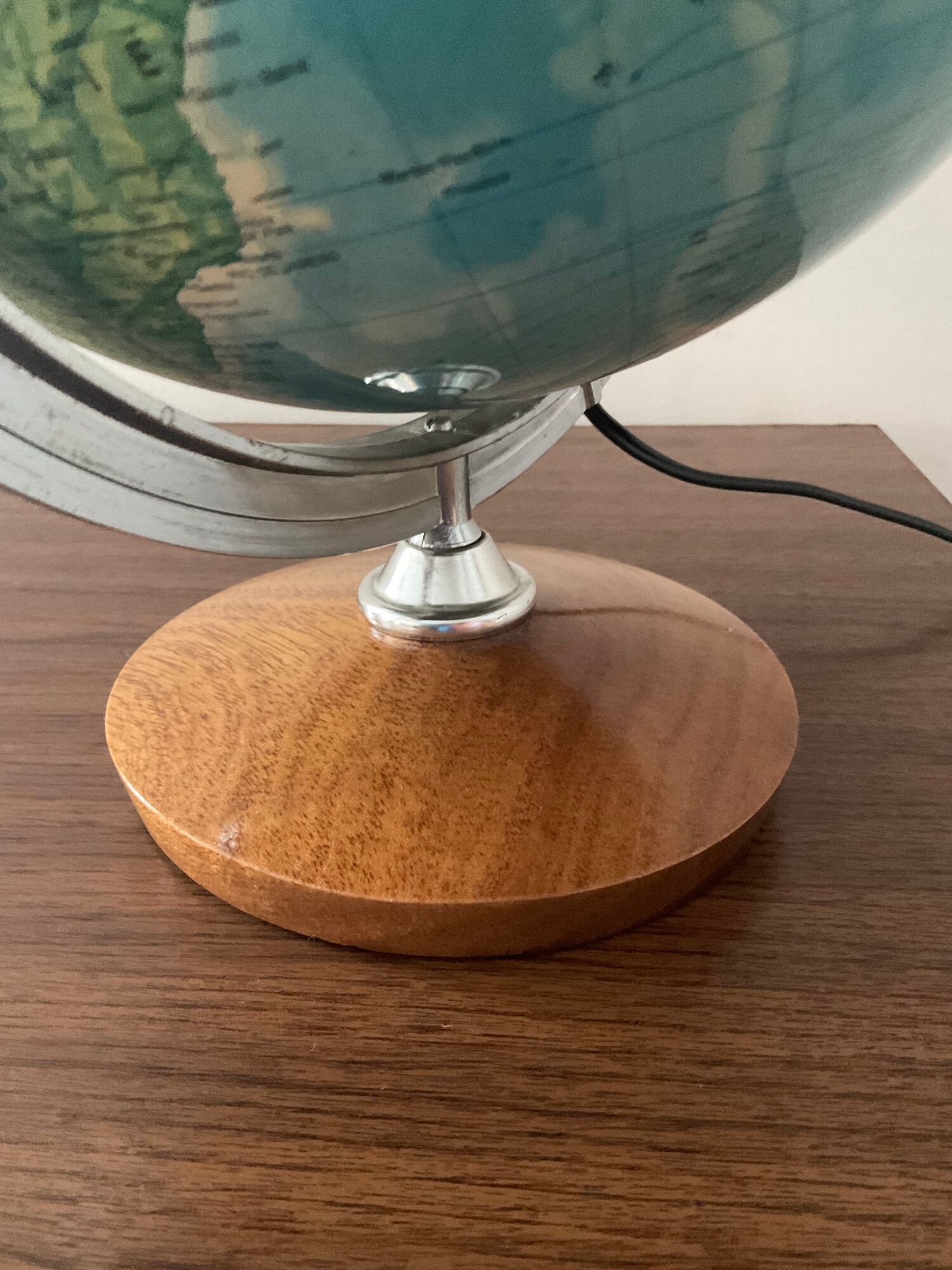 Bright vintage world map with wooden foot