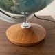 Bright vintage world map with wooden foot