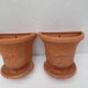 Duo of decorated terracotta wall flowerpots
