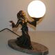 Art deco lamp in regul and marble "woman holding a globe"