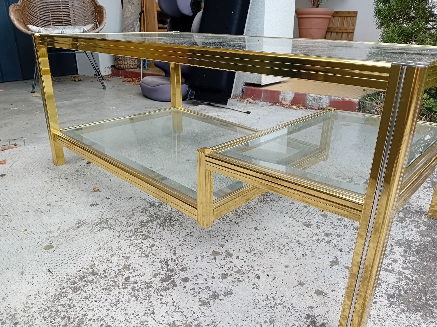 Glass and golden brass coffee table