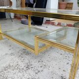 Glass and golden brass coffee table