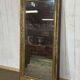 19th-century mirror in gilded wood and plaster.